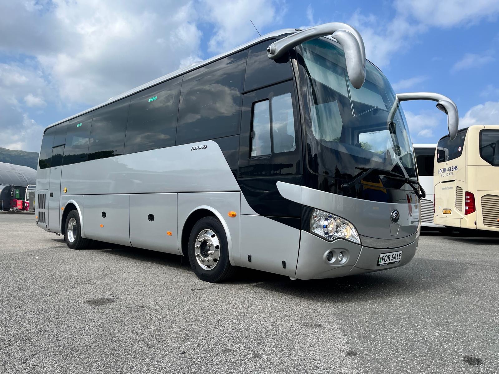 Used [Make & Model] Coach for Sale | Descriptive word